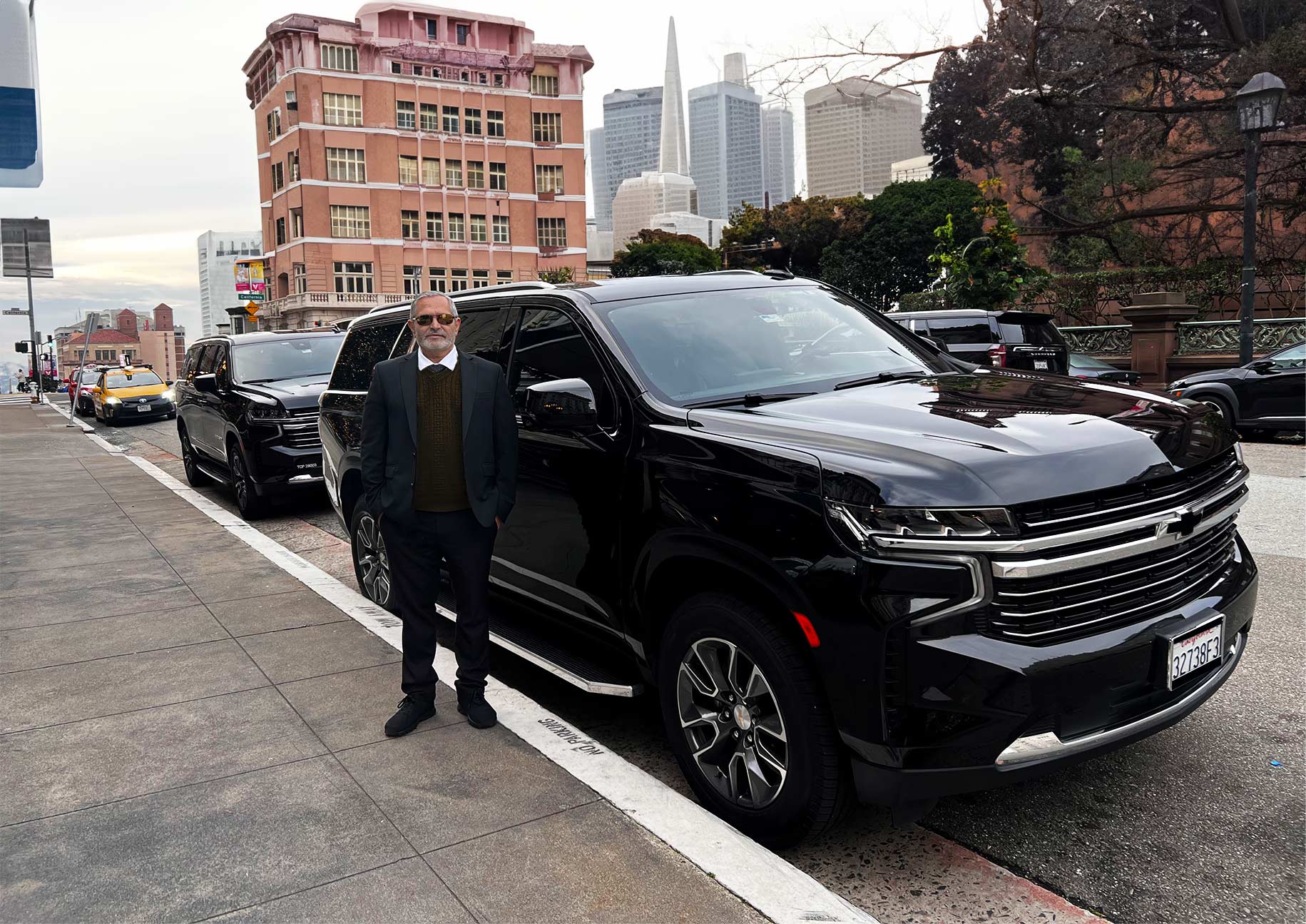  Professional chauffeur service in San Francisco downtown with luxury black SUVs for corporate and private transportation